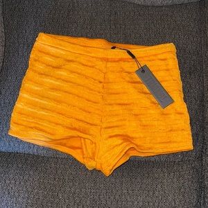 Orange Triangl bathing suit shorts